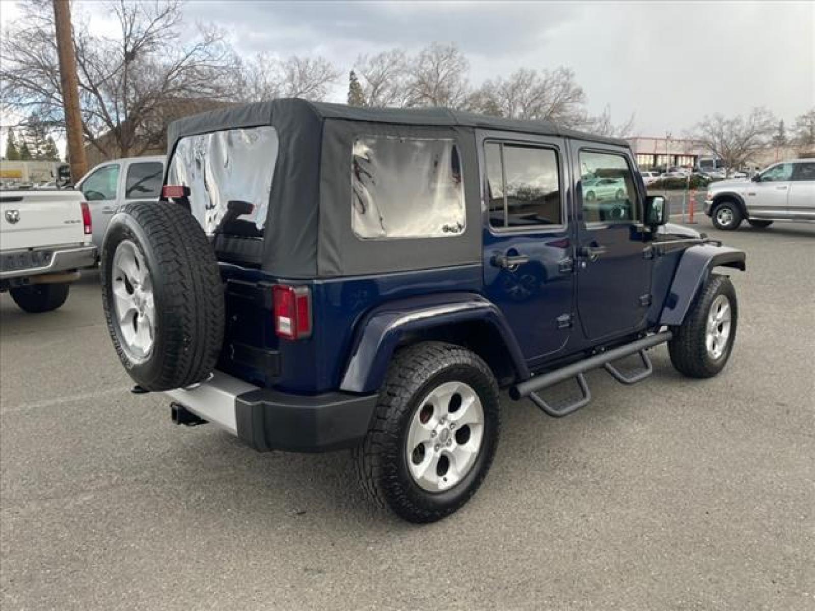 2013 True Blue Pearl Coat Jeep Wrangler Unlimited Sahara (1C4BJWEG7DL) with an 3.6L 3.6L V6 285hp 260ft. lbs. Sequential Multiport Fuel Injection engine, 5-Speed Automatic transmission, located at 800 Riverside Ave, Roseville, CA, 95678, (916) 773-4549, 38.732265, -121.291039 - Photo #3