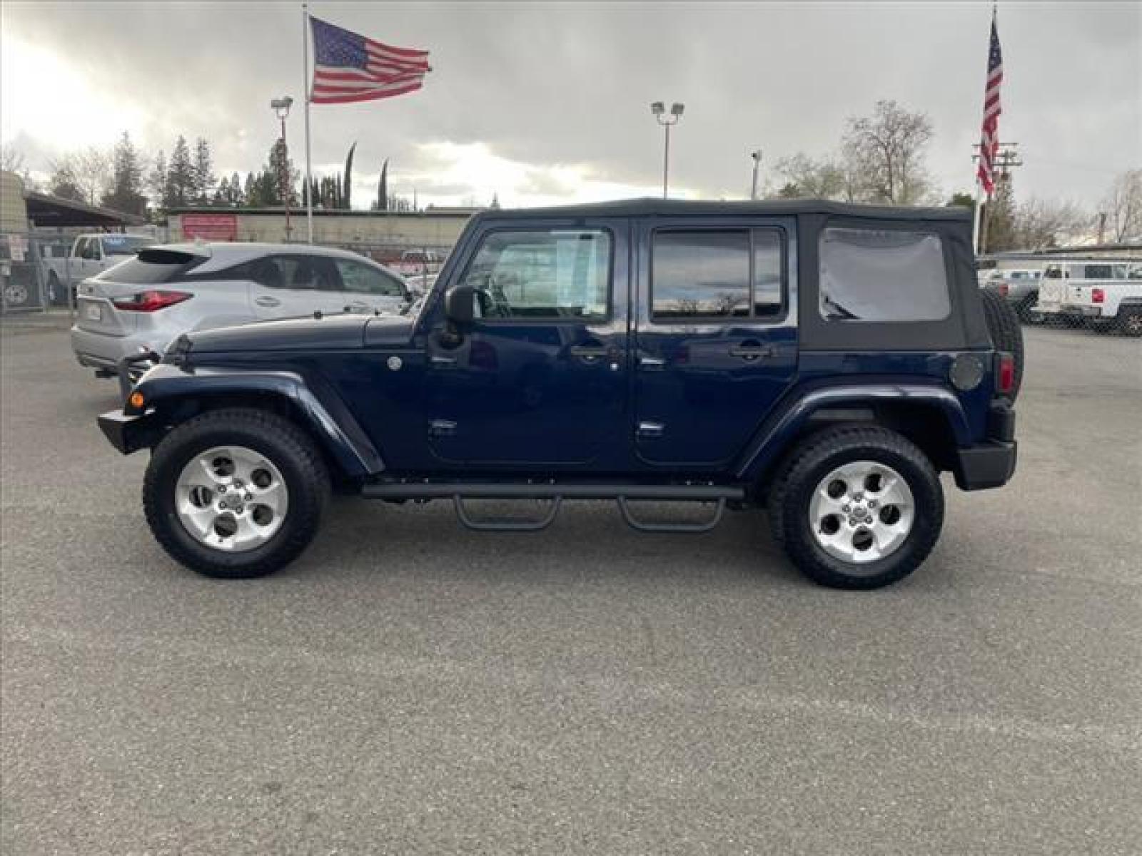 2013 True Blue Pearl Coat Jeep Wrangler Unlimited Sahara (1C4BJWEG7DL) with an 3.6L 3.6L V6 285hp 260ft. lbs. Sequential Multiport Fuel Injection engine, 5-Speed Automatic transmission, located at 800 Riverside Ave, Roseville, CA, 95678, (916) 773-4549, 38.732265, -121.291039 - Photo #4