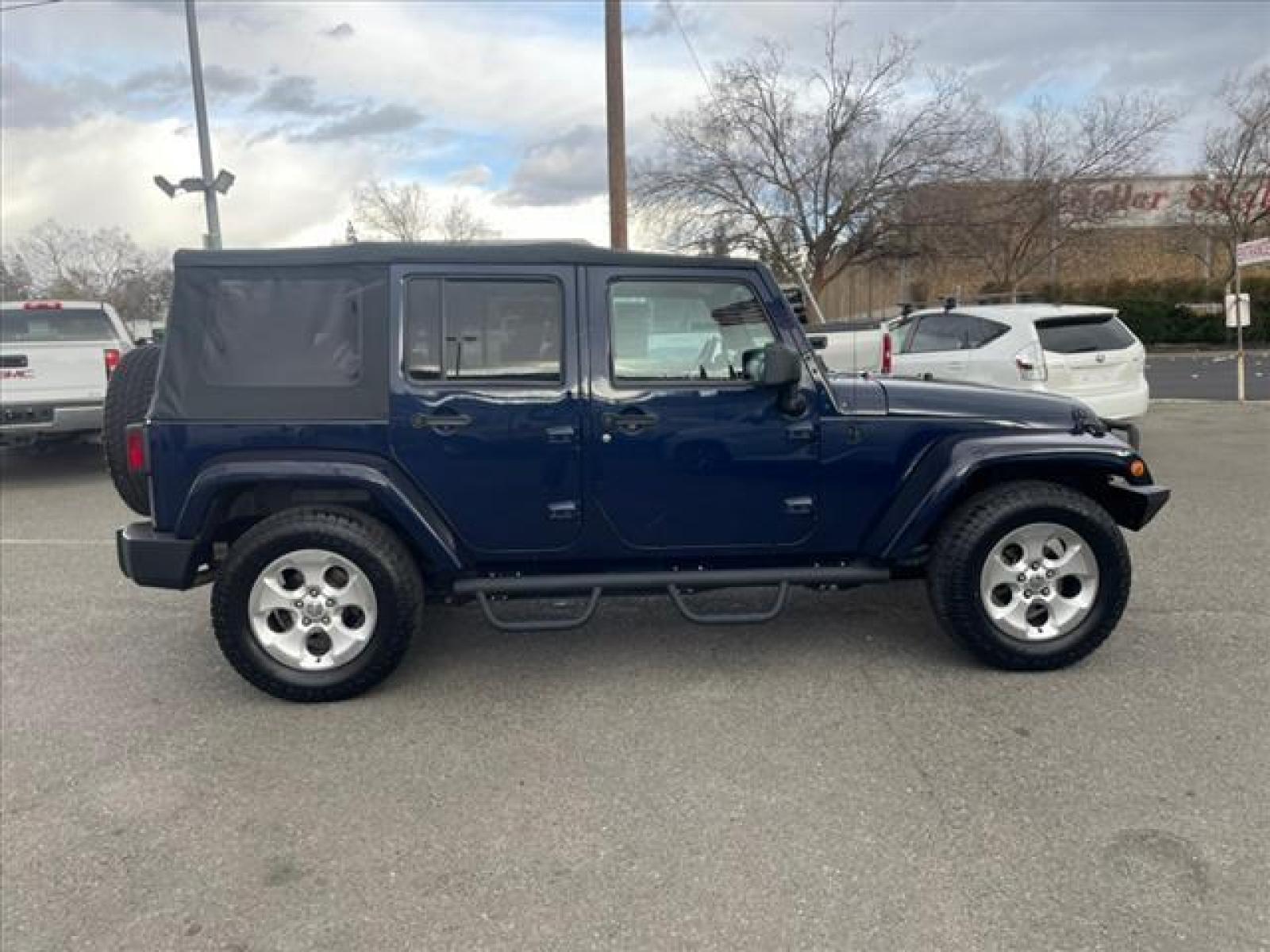 2013 True Blue Pearl Coat Jeep Wrangler Unlimited Sahara (1C4BJWEG7DL) with an 3.6L 3.6L V6 285hp 260ft. lbs. Sequential Multiport Fuel Injection engine, 5-Speed Automatic transmission, located at 800 Riverside Ave, Roseville, CA, 95678, (916) 773-4549, 38.732265, -121.291039 - Photo #5