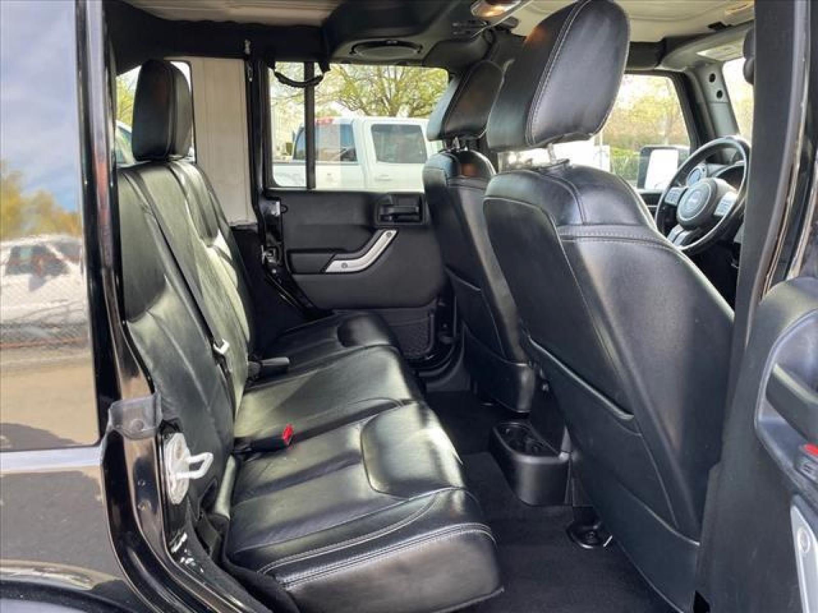 2013 Black Clear Coat Jeep Wrangler Unlimited Sahara (1C4BJWEG2DL) with an 3.6L 3.6L V6 285hp 260ft. lbs. Sequential Multiport Fuel Injection engine, 5-Speed Automatic transmission, located at 800 Riverside Ave, Roseville, CA, 95678, (916) 773-4549, 38.732265, -121.291039 - 4X4 UNLIMITED SAHARA HARDTOP CUSTOM WHEELS ONE OWNER - Photo #15
