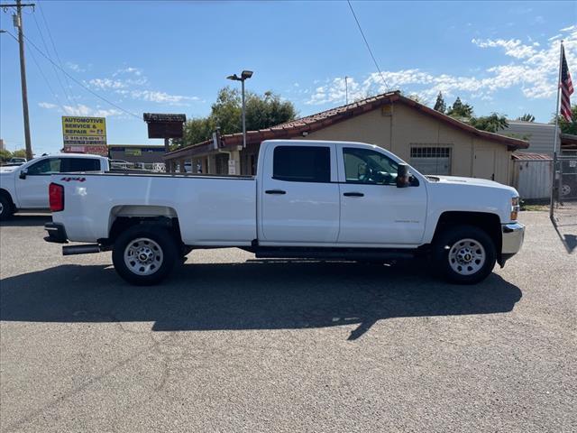 2018 Summit White Chevrolet Silverado 2500HD Work Truck (1GC1KUEY3JF) with an 6.6L Duramax 6.6L Biodiesel Turbo V8 445hp 910ft. lbs. Common Rail Direct Injection engine, 6-Speed Shiftable Automatic transmission, located at 800 Riverside Ave, Roseville, CA, 95678, 916-773-4549 & Toll Free: 866-719-4393, 38.732265, -121.291039 - DURAMAX DIESEL CREW CAB 4X4 ONE OWNER CLEAN CARFAX - Photo #5