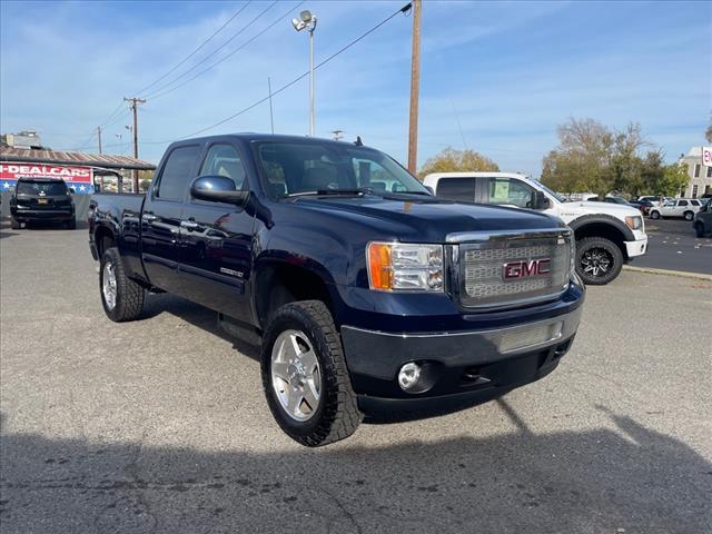 2012 Midnight Blue Metallic GMC Sierra 2500HD SLT (1GT121E87CF) with an 6.6L Duramax 6.6L Diesel Turbo V8 397hp 765ft. lbs. Common Rail Direct Injection engine, Allison 1000 6-Speed Shiftable Automatic transmission, located at 800 Riverside Ave, Roseville, CA, 95678, 916-773-4549 & Toll Free: 866-719-4393, 38.732265, -121.291039 - DURAMAX DIESEL CREW CAB 4X4 SLT 87K MILES DVD ALLISON TRANSMISSION - Photo #1