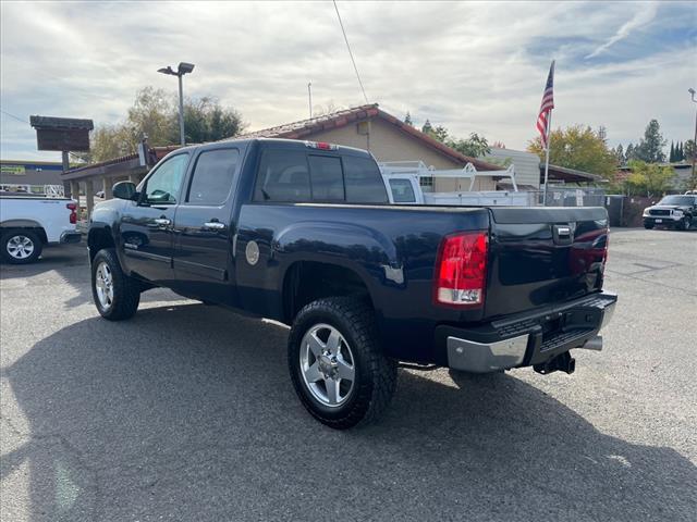 2012 Midnight Blue Metallic GMC Sierra 2500HD SLT (1GT121E87CF) with an 6.6L Duramax 6.6L Diesel Turbo V8 397hp 765ft. lbs. Common Rail Direct Injection engine, Allison 1000 6-Speed Shiftable Automatic transmission, located at 800 Riverside Ave, Roseville, CA, 95678, 916-773-4549 & Toll Free: 866-719-4393, 38.732265, -121.291039 - DURAMAX DIESEL CREW CAB 4X4 SLT 87K MILES DVD ALLISON TRANSMISSION - Photo #2