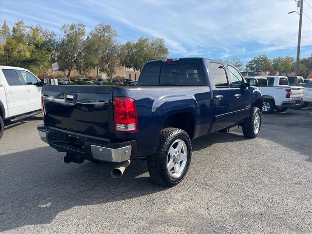 2012 Midnight Blue Metallic GMC Sierra 2500HD SLT (1GT121E87CF) with an 6.6L Duramax 6.6L Diesel Turbo V8 397hp 765ft. lbs. Common Rail Direct Injection engine, Allison 1000 6-Speed Shiftable Automatic transmission, located at 800 Riverside Ave, Roseville, CA, 95678, 916-773-4549 & Toll Free: 866-719-4393, 38.732265, -121.291039 - DURAMAX DIESEL CREW CAB 4X4 SLT 87K MILES DVD ALLISON TRANSMISSION - Photo #3
