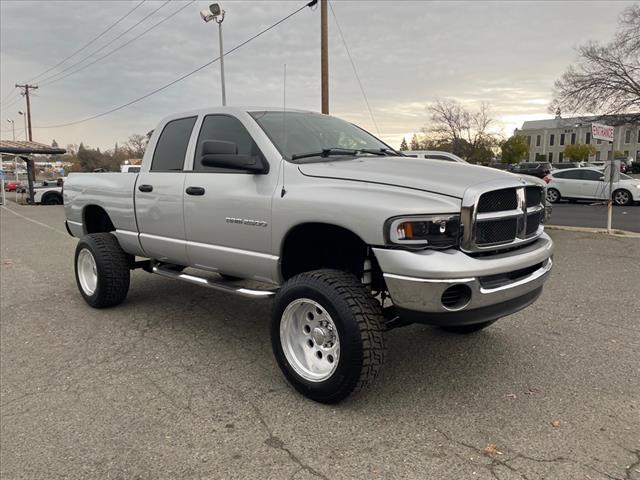2004 Bright Silver Metallic Clearcoat Dodge Ram 2500 SLT (3D7KU286X4G) with an Cummins 5.9L Diesel Turbo I6 235hp 460ft. lbs. Other engine, 4-Speed Automatic transmission, located at 800 Riverside Ave, Roseville, CA, 95678, 916-773-4549 & Toll Free: 866-719-4393, 38.732265, -121.291039 - CUMMINS DIESEL QUAD CAB 4X4 SLT LOW MILES LIFTED CLEAN CARFAX - Photo #1