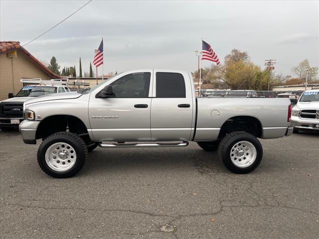 2004 Bright Silver Metallic Clearcoat Dodge Ram 2500 SLT (3D7KU286X4G) with an Cummins 5.9L Diesel Turbo I6 235hp 460ft. lbs. Other engine, 4-Speed Automatic transmission, located at 800 Riverside Ave, Roseville, CA, 95678, 916-773-4549 & Toll Free: 866-719-4393, 38.732265, -121.291039 - CUMMINS DIESEL QUAD CAB 4X4 SLT LOW MILES LIFTED CLEAN CARFAX - Photo #4