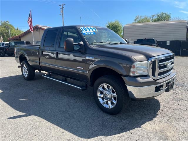 2005 Dark Stone Clearcoat Metallic Ford F-350 Super Duty XLT (1FTWW31P45E) with an 6.0L Power Stroke 6.0L Diesel Turbo V8 325hp 560ft. lbs. Direct Injection engine, 5-Speed Automatic transmission, located at 800 Riverside Ave, Roseville, CA, 95678, 916-773-4549 & Toll Free: 866-719-4393, 38.732265, -121.291039 - DIESEL CREW CAB 4X4 90K MILES CLEAN CARFAX - Photo #1