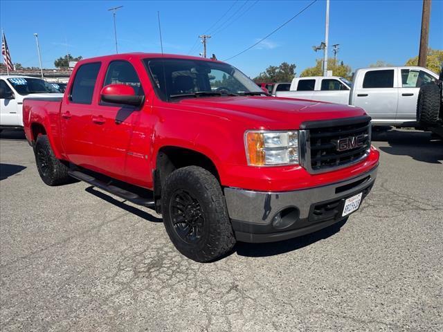 2007 Fire Red GMC Sierra 1500 SLT (2GTFK13Y871) with an 6.0L VortecMAX 6.0L V8 367hp 375ft. lbs. Other engine, 4-Speed Automatic transmission, located at 800 Riverside Ave, Roseville, CA, 95678, (916) 773-4549, 38.732265, -121.291039 - 4X4 CREW CAB SLT VORTEC MAX LOW MILES LEATHER DVD ONE OWNER SERVICE RECORDS - Photo#1
