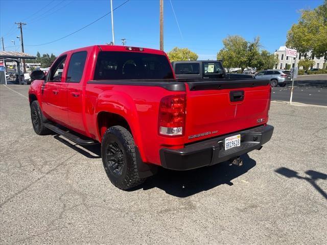 2007 Fire Red GMC Sierra 1500 SLT (2GTFK13Y871) with an 6.0L VortecMAX 6.0L V8 367hp 375ft. lbs. Other engine, 4-Speed Automatic transmission, located at 800 Riverside Ave, Roseville, CA, 95678, (916) 773-4549, 38.732265, -121.291039 - 4X4 CREW CAB SLT VORTEC MAX LOW MILES LEATHER DVD ONE OWNER SERVICE RECORDS - Photo#3