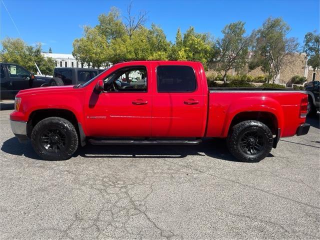 2007 Fire Red GMC Sierra 1500 SLT (2GTFK13Y871) with an 6.0L VortecMAX 6.0L V8 367hp 375ft. lbs. Other engine, 4-Speed Automatic transmission, located at 800 Riverside Ave, Roseville, CA, 95678, (916) 773-4549, 38.732265, -121.291039 - 4X4 CREW CAB SLT VORTEC MAX LOW MILES LEATHER DVD ONE OWNER SERVICE RECORDS - Photo#6