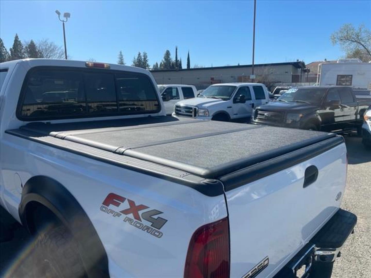 2005 Oxford White Clearcoat Ford F-250 Super Duty Lariat (1FTSW21PX5E) with an 6.0L Power Stroke 6.0L Diesel Turbo V8 325hp 560ft. lbs. Direct Injection engine, 5-Speed Automatic transmission, located at 800 Riverside Ave, Roseville, CA, 95678, (916) 773-4549, 38.732265, -121.291039 - DIESEL CREW CAB 4X4 FX4 LARIAT HEADSTUDS LIFTED AIR BAG SUSPENSION POWER RUNNING BOARDS CLEAN CARFAX - Photo#11