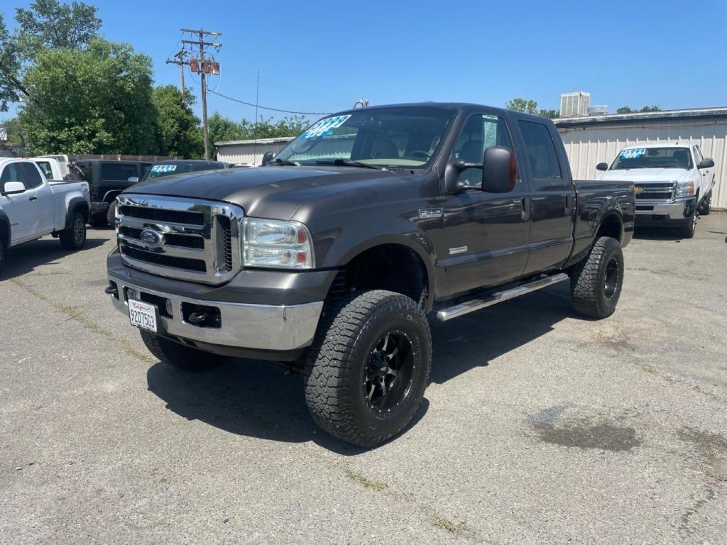 2006 Brown Ford F-250 Super Duty Lariat (1FTSW21P16E) with an 6.0L Power Stroke 6.0L Diesel Turbo V8 325hp 560ft. lbs. Direct Injection engine, 5-Speed Automatic transmission, located at 800 Riverside Ave, Roseville, CA, 95678, (916) 773-4549, 38.732265, -121.291039 - DIESEL CREW CAB 4X4 LARIAT LIFTED HEADSTUDS BULLET PROOF EGR COOLER SERVICE RECORDS - Photo#0