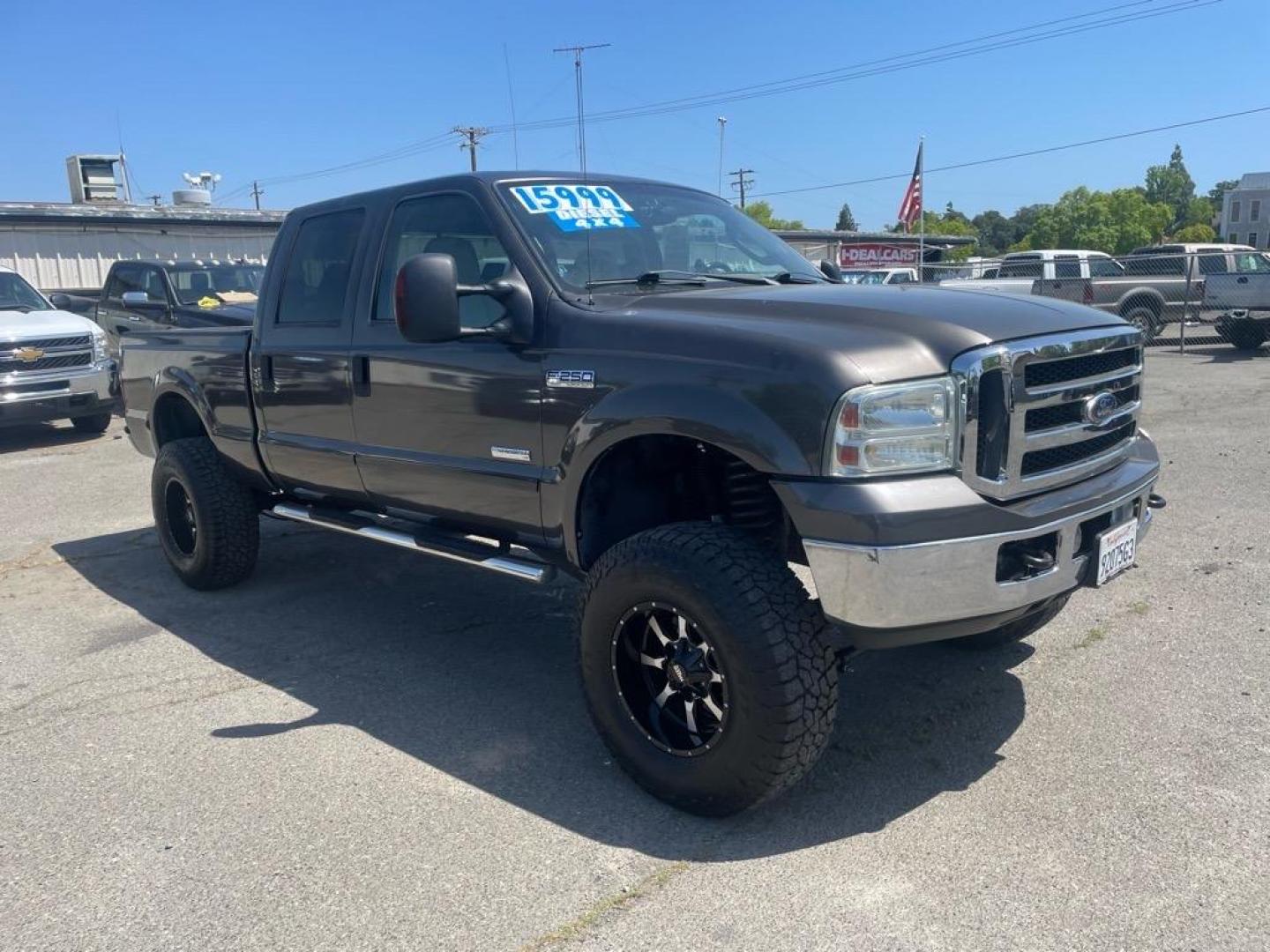 2006 Brown Ford F-250 Super Duty Lariat (1FTSW21P16E) with an 6.0L Power Stroke 6.0L Diesel Turbo V8 325hp 560ft. lbs. Direct Injection engine, 5-Speed Automatic transmission, located at 800 Riverside Ave, Roseville, CA, 95678, (916) 773-4549, 38.732265, -121.291039 - DIESEL CREW CAB 4X4 LARIAT LIFTED HEADSTUDS BULLET PROOF EGR COOLER SERVICE RECORDS - Photo#1