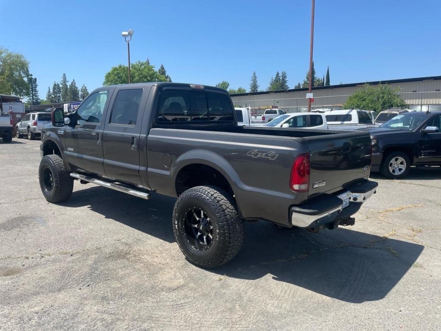 2006 Brown Ford F-250 Super Duty Lariat (1FTSW21P16E) with an 6.0L Power Stroke 6.0L Diesel Turbo V8 325hp 560ft. lbs. Direct Injection engine, 5-Speed Automatic transmission, located at 800 Riverside Ave, Roseville, CA, 95678, (916) 773-4549, 38.732265, -121.291039 - DIESEL CREW CAB 4X4 LARIAT LIFTED HEADSTUDS BULLET PROOF EGR COOLER SERVICE RECORDS - Photo#2