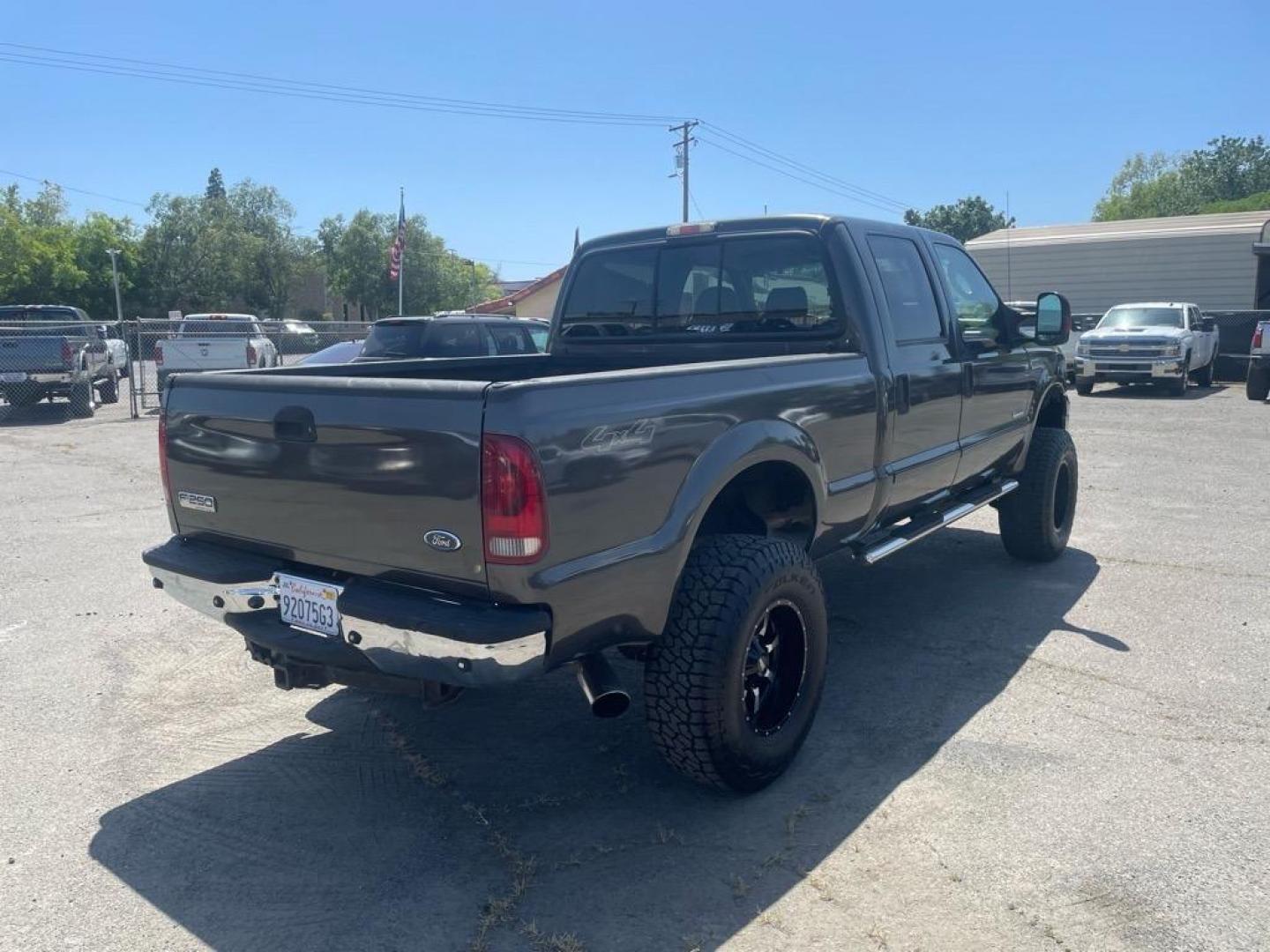 2006 Brown Ford F-250 Super Duty Lariat (1FTSW21P16E) with an 6.0L Power Stroke 6.0L Diesel Turbo V8 325hp 560ft. lbs. Direct Injection engine, 5-Speed Automatic transmission, located at 800 Riverside Ave, Roseville, CA, 95678, (916) 773-4549, 38.732265, -121.291039 - DIESEL CREW CAB 4X4 LARIAT LIFTED HEADSTUDS BULLET PROOF EGR COOLER SERVICE RECORDS - Photo#3