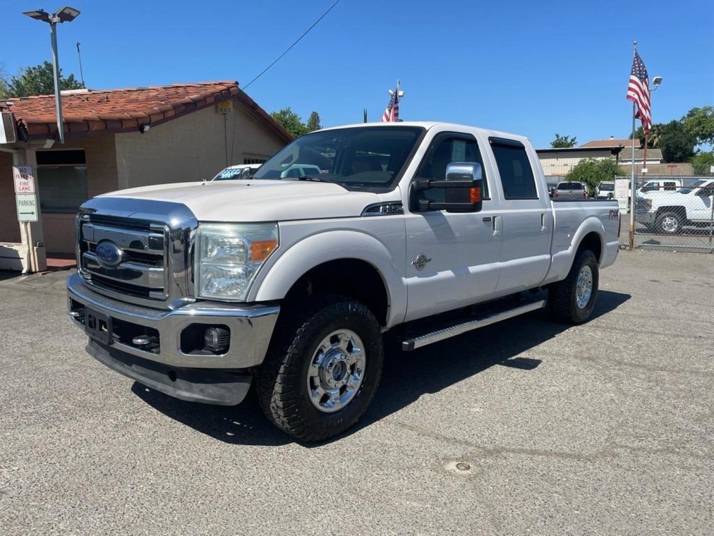 2013 Oxford White Ford F-250 Super Duty Lariat (1FT7W2BT4DE) with an 6.7L Power Stroke 6.7L Biodiesel Turbo V8 400hp 800ft. lbs. Common Rail Direct Injection engine, 6-Speed Shiftable Automatic transmission, located at 800 Riverside Ave, Roseville, CA, 95678, (916) 773-4549, 38.732265, -121.291039 - DIESEL CREW CAB 4X4 FX4 LARIAT MOON ROOF SERVICE RECORDS - Photo#0