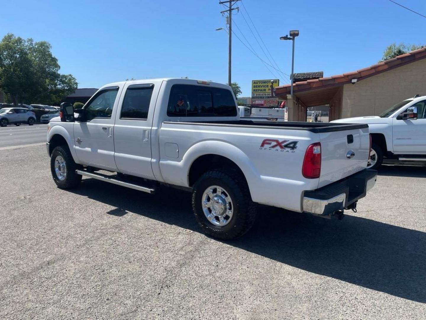 2013 Oxford White Ford F-250 Super Duty Lariat (1FT7W2BT4DE) with an 6.7L Power Stroke 6.7L Biodiesel Turbo V8 400hp 800ft. lbs. Common Rail Direct Injection engine, 6-Speed Shiftable Automatic transmission, located at 800 Riverside Ave, Roseville, CA, 95678, (916) 773-4549, 38.732265, -121.291039 - DIESEL CREW CAB 4X4 FX4 LARIAT MOON ROOF SERVICE RECORDS - Photo#2