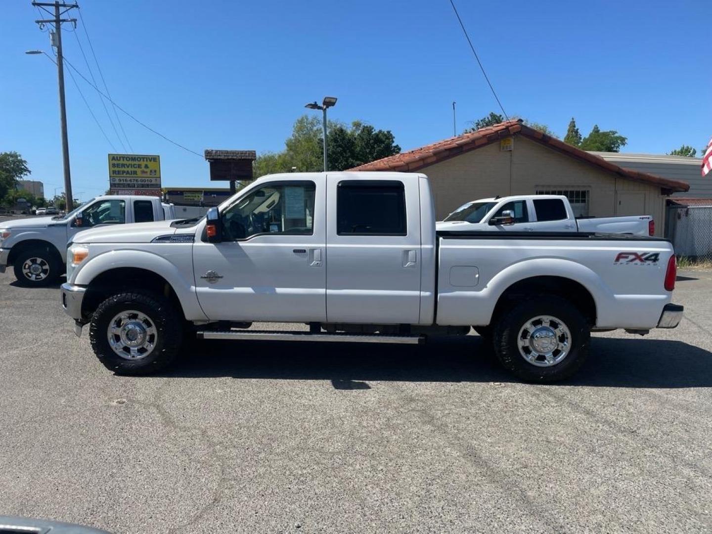 2013 Oxford White Ford F-250 Super Duty Lariat (1FT7W2BT4DE) with an 6.7L Power Stroke 6.7L Biodiesel Turbo V8 400hp 800ft. lbs. Common Rail Direct Injection engine, 6-Speed Shiftable Automatic transmission, located at 800 Riverside Ave, Roseville, CA, 95678, (916) 773-4549, 38.732265, -121.291039 - DIESEL CREW CAB 4X4 FX4 LARIAT MOON ROOF SERVICE RECORDS - Photo#4