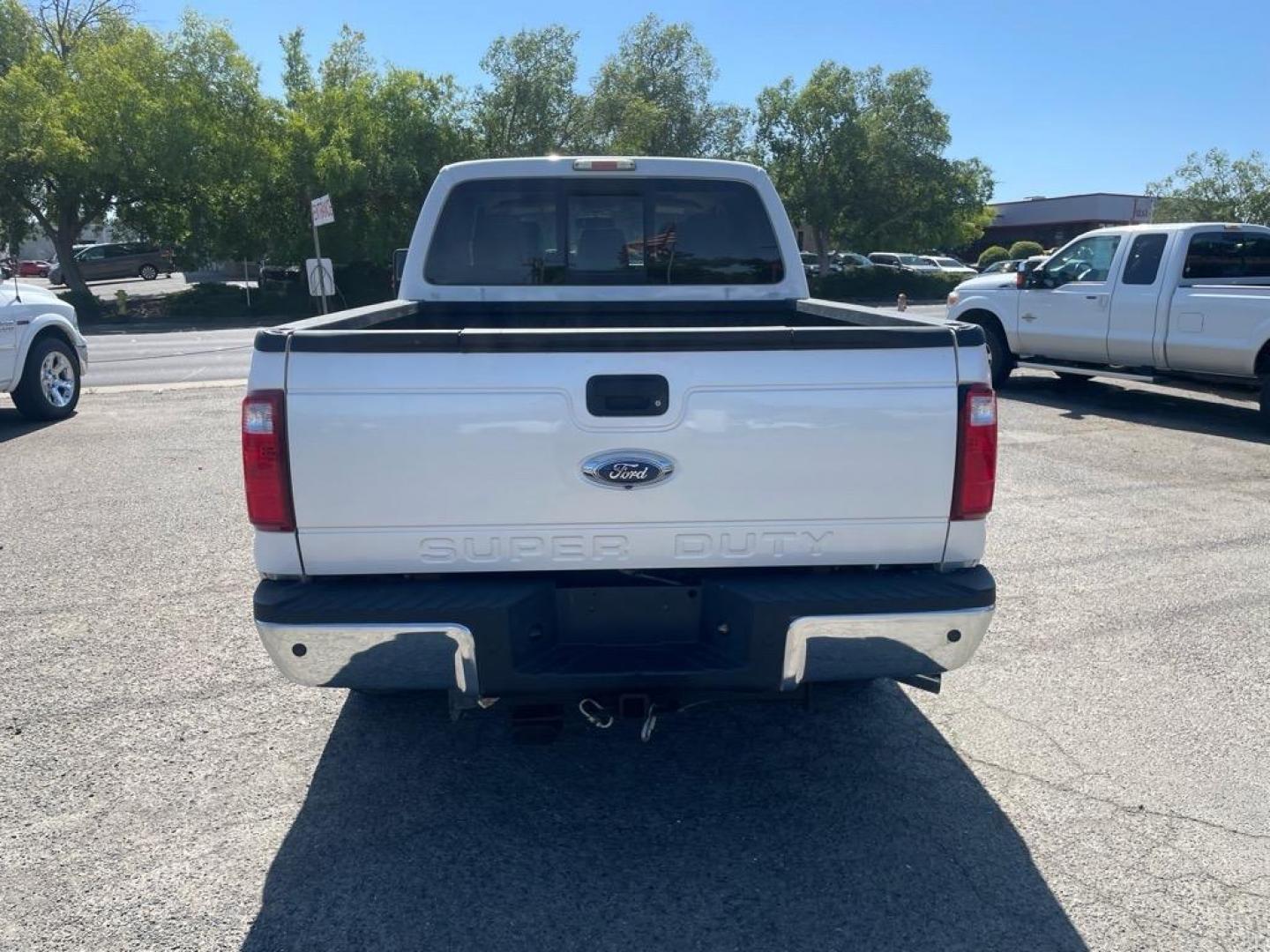 2013 Oxford White Ford F-250 Super Duty Lariat (1FT7W2BT4DE) with an 6.7L Power Stroke 6.7L Biodiesel Turbo V8 400hp 800ft. lbs. Common Rail Direct Injection engine, 6-Speed Shiftable Automatic transmission, located at 800 Riverside Ave, Roseville, CA, 95678, (916) 773-4549, 38.732265, -121.291039 - DIESEL CREW CAB 4X4 FX4 LARIAT MOON ROOF SERVICE RECORDS - Photo#7