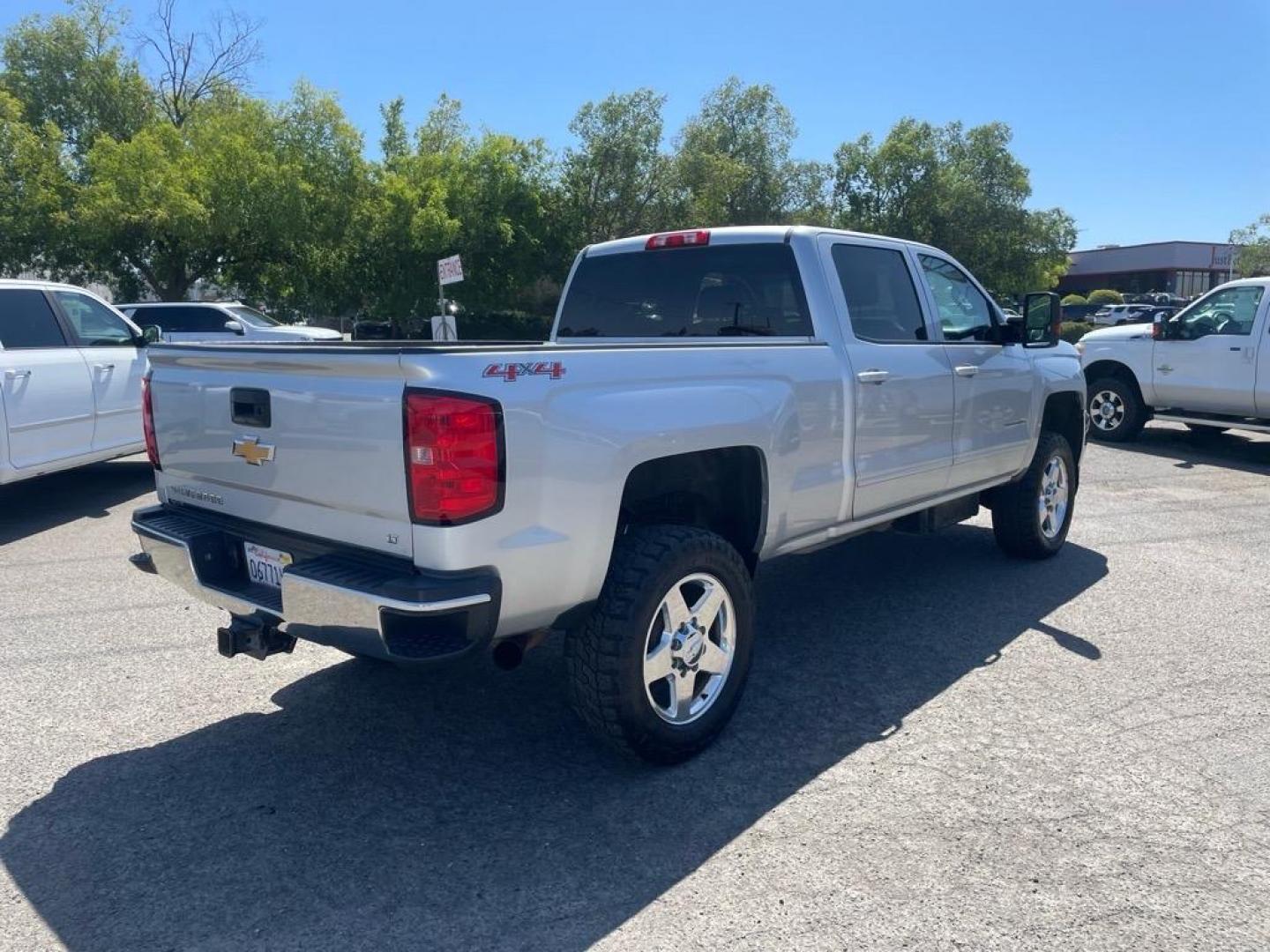 2015 Silver Ice Metallic Chevrolet Silverado 2500HD LT (1GC1KVE87FF) with an 6.6L Duramax 6.6L Diesel Turbo V8 397hp 765ft. lbs. Common Rail Direct Injection engine, Allison 1000 6-Speed Shiftable Automatic transmission, located at 800 Riverside Ave, Roseville, CA, 95678, (916) 773-4549, 38.732265, -121.291039 - DURAMAX DIESEL CREW CAB 4X4 LT ALLISON TRANSMISSION ONE OWNER CLEAN CARFAX - Photo#4