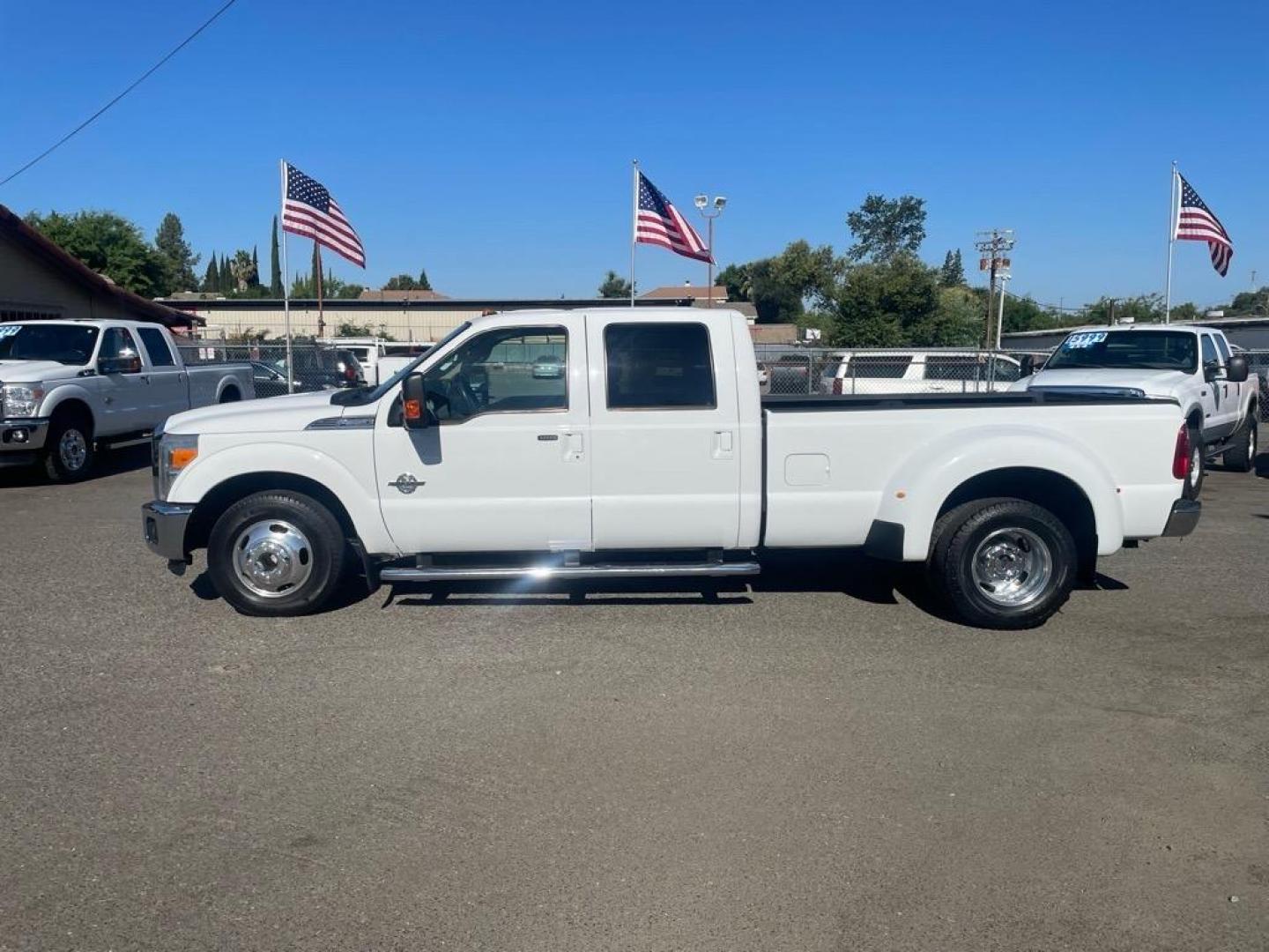 2014 Oxford White Ford F-350 Super Duty Lariat (1FT8W3CT8EE) with an 6.7L Power Stroke 6.7L Biodiesel Turbo V8 400hp 800ft. lbs. Common Rail Direct Injection engine, 6-Speed Shiftable Automatic transmission, located at 800 Riverside Ave, Roseville, CA, 95678, (916) 773-4549, 38.732265, -121.291039 - DIESEL CREW CAB DUALLY LARIAT SERVICE RECORDS ON CLEAN CARFAX - Photo#4