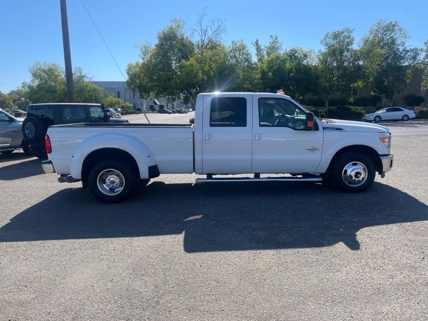 2014 Oxford White Ford F-350 Super Duty Lariat (1FT8W3CT8EE) with an 6.7L Power Stroke 6.7L Biodiesel Turbo V8 400hp 800ft. lbs. Common Rail Direct Injection engine, 6-Speed Shiftable Automatic transmission, located at 800 Riverside Ave, Roseville, CA, 95678, (916) 773-4549, 38.732265, -121.291039 - DIESEL CREW CAB DUALLY LARIAT SERVICE RECORDS ON CLEAN CARFAX - Photo#5