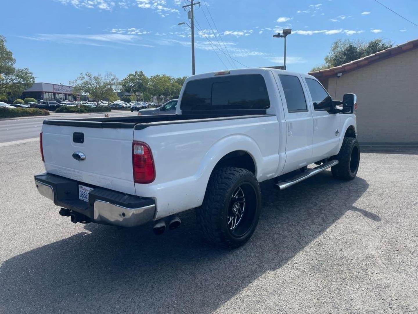 2014 Oxford White Ford F-250 Super Duty Lariat (1FT7W2BT5EE) with an 6.7L Power Stroke 6.7L Biodiesel Turbo V8 400hp 800ft. lbs. Common Rail Direct Injection engine, 6-Speed Shiftable Automatic transmission, located at 800 Riverside Ave, Roseville, CA, 95678, (916) 773-4549, 38.732265, -121.291039 - DIESEL CREW CAB 4X4 LARIAT CLEAN CARFAX - Photo#3