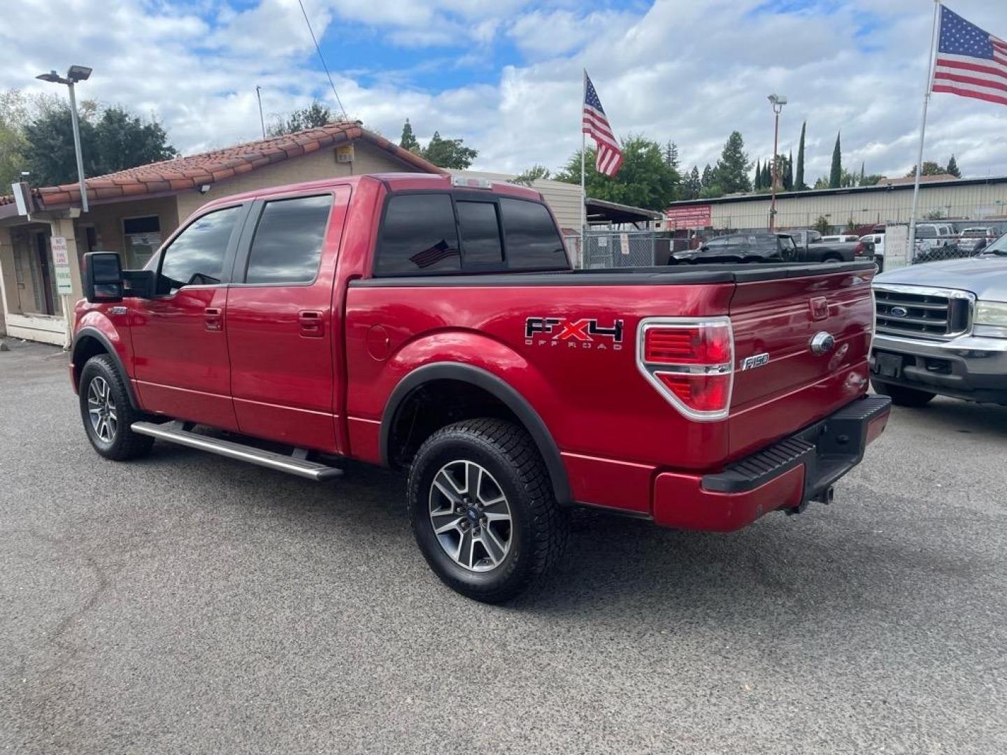2010 Red Candy Metallic Ford F-150 FX4 (1FTFW1EVXAF) with an 5.4L Triton 5.4L Flex Fuel V8 320hp 390ft. lbs. Sequential Multiport Fuel Injection engine, 6-Speed Automatic transmission, located at 800 Riverside Ave, Roseville, CA, 95678, (916) 773-4549, 38.732265, -121.291039 - Photo#2
