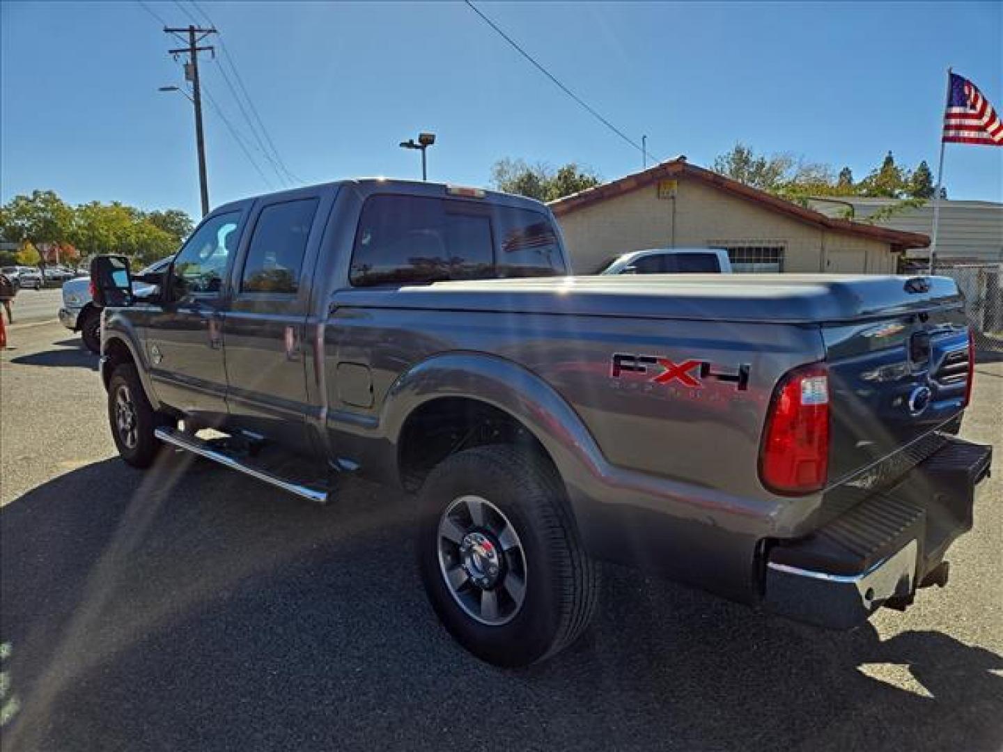 2011 Sterling Grey Metallic Ford F-250 Super Duty Lariat (1FT7W2BT1BE) with an 6.7L Power Stroke 6.7L Biodiesel Turbo V8 400hp 800ft. lbs. Common Rail Direct Injection engine, 6-Speed Shiftable Automatic transmission, located at 800 Riverside Ave, Roseville, CA, 95678, (916) 773-4549, 38.732265, -121.291039 - Photo#2