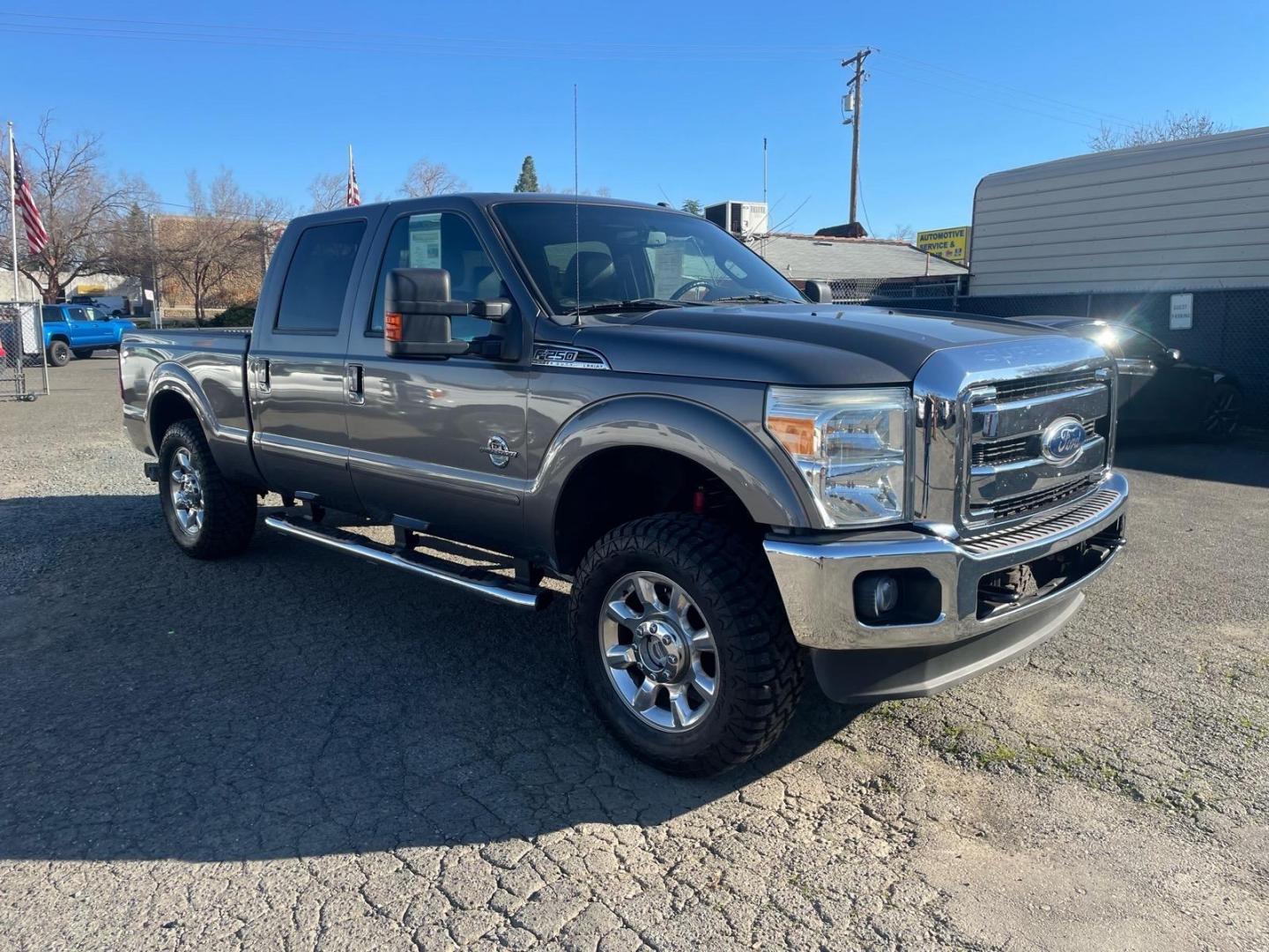 2011 Sterling Grey Metallic Ford F-250 Super Duty Lariat (1FT7W2BT3BE) with an 6.7L Power Stroke 6.7L Biodiesel Turbo V8 400hp 800ft. lbs. Common Rail Direct Injection engine, 6-Speed Shiftable Automatic transmission, located at 800 Riverside Ave, Roseville, CA, 95678, (916) 773-4549, 38.732265, -121.291039 - DIESEL CREW CAB 4X4 FX4 NEW TIRES SERVICE RECORDS - Photo#1