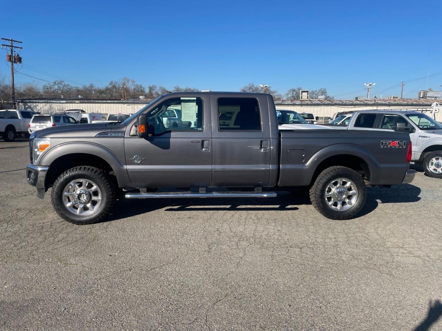 2011 Sterling Grey Metallic Ford F-250 Super Duty Lariat (1FT7W2BT3BE) with an 6.7L Power Stroke 6.7L Biodiesel Turbo V8 400hp 800ft. lbs. Common Rail Direct Injection engine, 6-Speed Shiftable Automatic transmission, located at 800 Riverside Ave, Roseville, CA, 95678, (916) 773-4549, 38.732265, -121.291039 - DIESEL CREW CAB 4X4 FX4 NEW TIRES SERVICE RECORDS - Photo#3