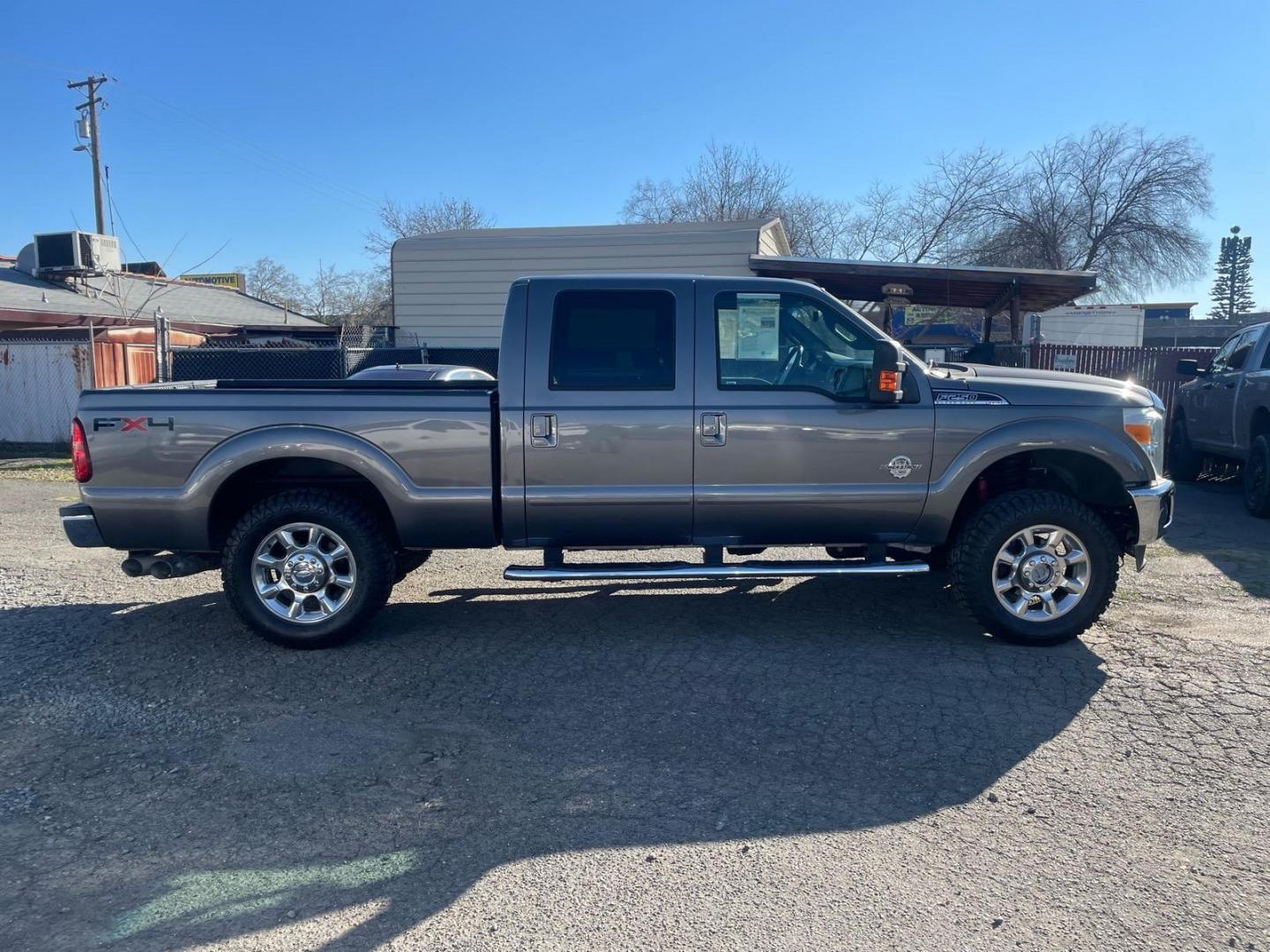 2011 Sterling Grey Metallic Ford F-250 Super Duty Lariat (1FT7W2BT3BE) with an 6.7L Power Stroke 6.7L Biodiesel Turbo V8 400hp 800ft. lbs. Common Rail Direct Injection engine, 6-Speed Shiftable Automatic transmission, located at 800 Riverside Ave, Roseville, CA, 95678, (916) 773-4549, 38.732265, -121.291039 - DIESEL CREW CAB 4X4 FX4 NEW TIRES SERVICE RECORDS - Photo#4