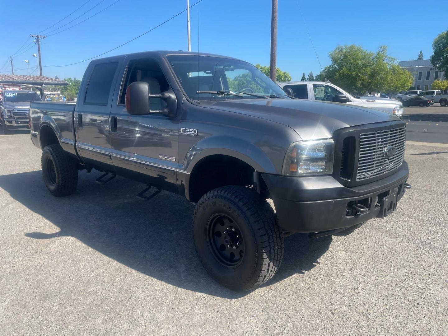 2003 Dark Shadow Grey Metallic/Black Ford F-250 Super Duty Lariat (1FTNW21P03E) with an Power Stroke 6.0L Diesel Turbo V8 325hp 560ft. lbs. Other engine, 5-Speed Automatic transmission, located at 800 Riverside Ave, Roseville, CA, 95678, (916) 773-4549, 38.732265, -121.291039 - DIESEL CREW CAB 4X4 LARIAT LOW MILES LIFTED CLEAN CARFAX - Photo#1