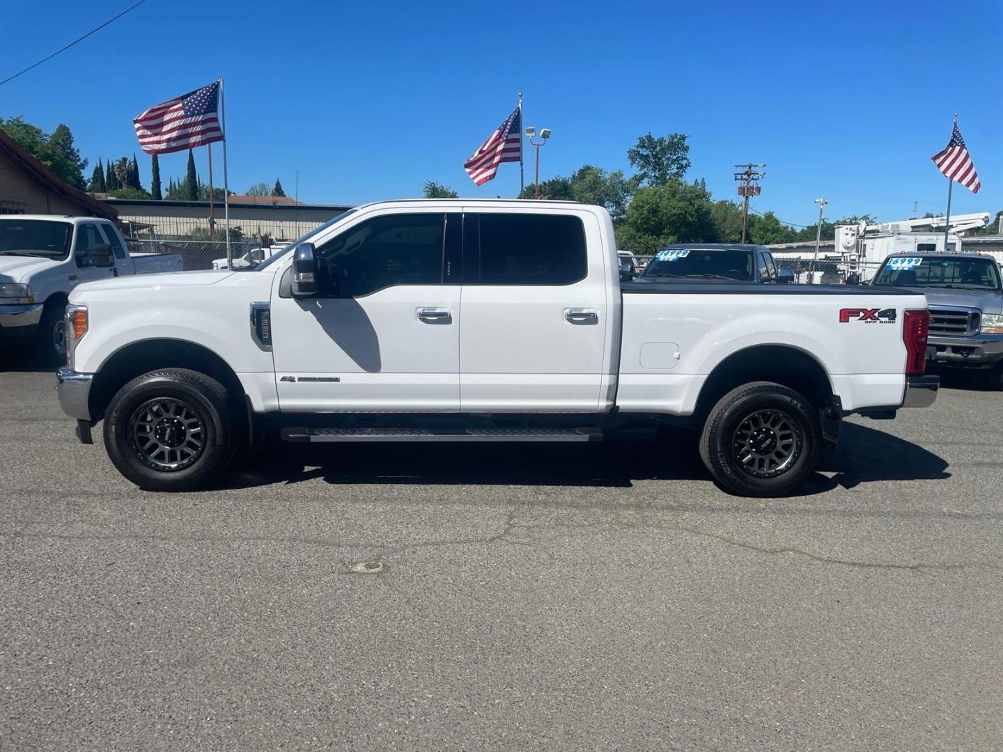 2017 Oxford White Ford F-250 Super Duty Lariat (1FT7W2BT0HE) with an 6.7L Power Stroke 6.7L Biodiesel Turbo V8 440hp 925ft. lbs. Common Rail Direct Injection engine, 6-Speed Shiftable Automatic transmission, located at 800 Riverside Ave, Roseville, CA, 95678, (916) 773-4549, 38.732265, -121.291039 - DIESEL CREW CAB 4X4 FX4 LARIAT TWIN PANEL MOON ROOF SERVICE RECORDS - Photo#4