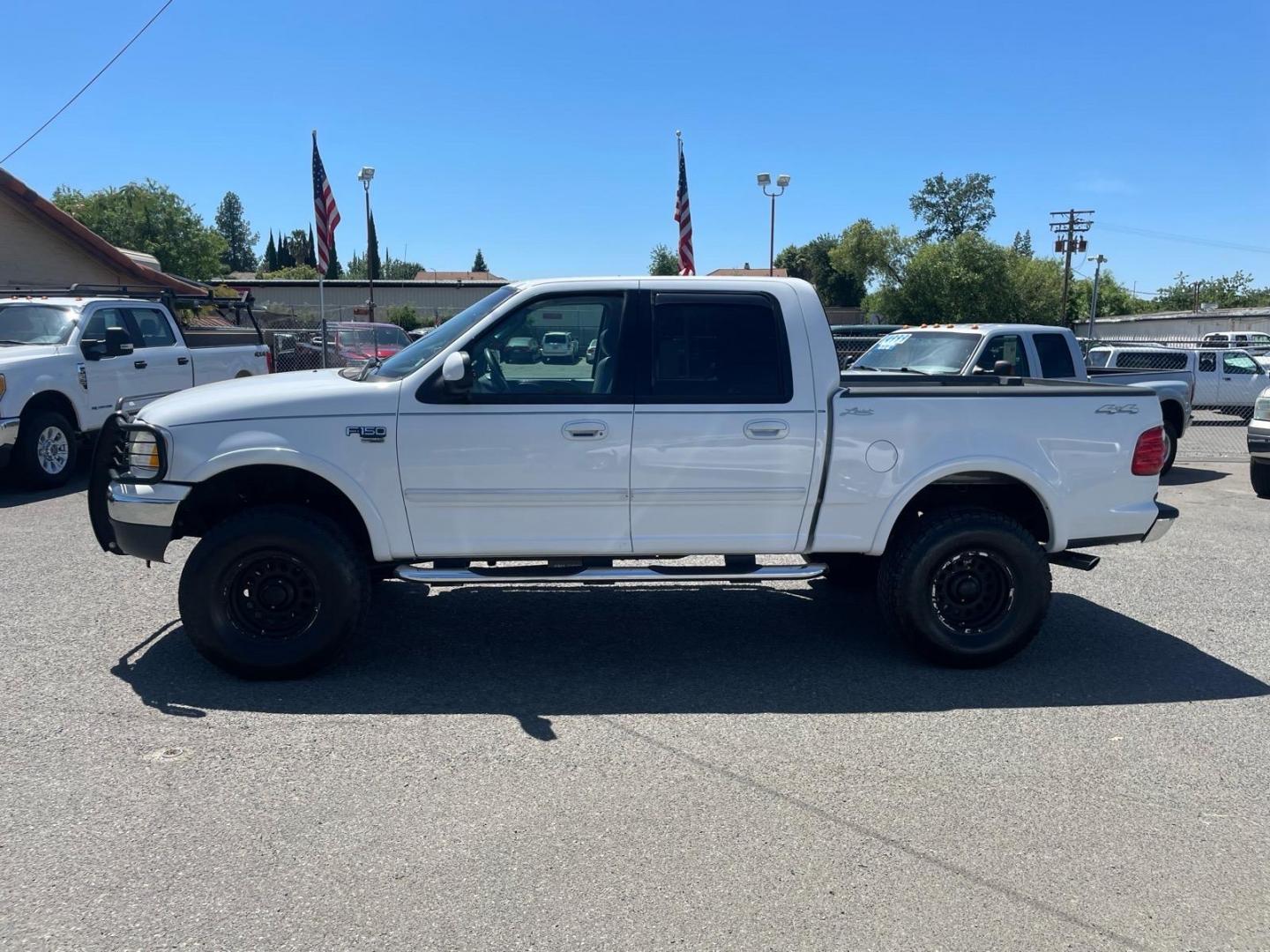 2003 Oxford White Ford F-150 Lariat (1FTRW08L83K) with an Triton 5.4L V8 260hp 350ft. lbs. Other engine, 4-Speed Automatic transmission, located at 800 Riverside Ave, Roseville, CA, 95678, (916) 773-4549, 38.732265, -121.291039 - 4X4 SUPERCREW LARIAT LOW MILES MOON ROOF- Photo#4