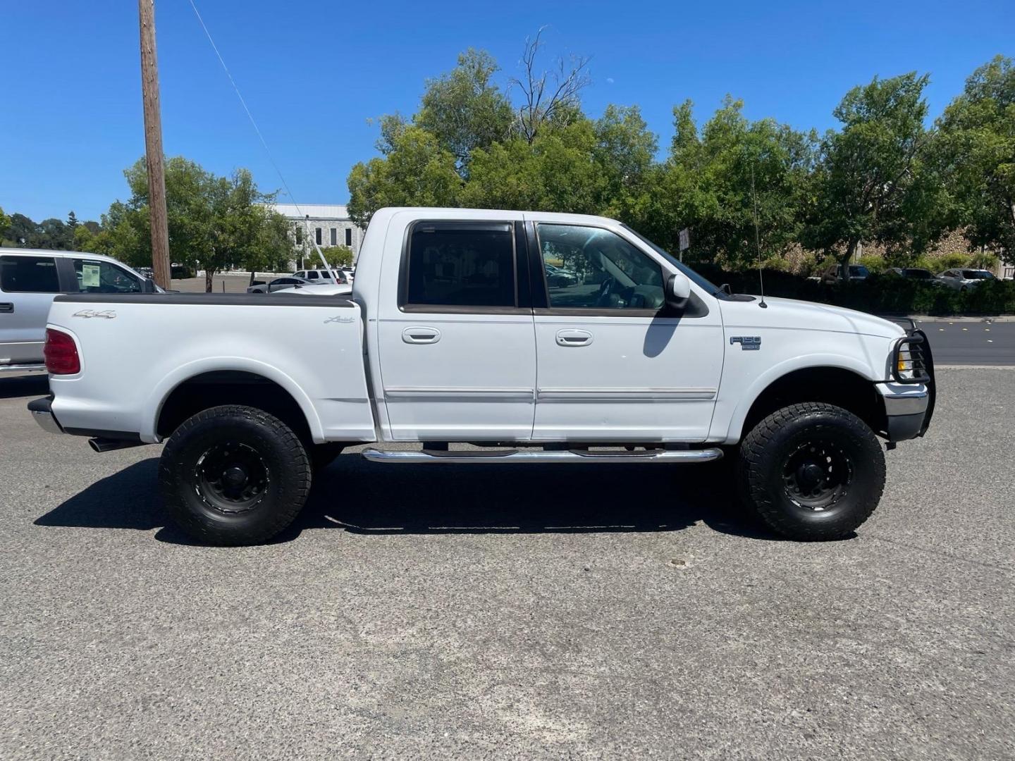 2003 Oxford White Ford F-150 Lariat (1FTRW08L83K) with an Triton 5.4L V8 260hp 350ft. lbs. Other engine, 4-Speed Automatic transmission, located at 800 Riverside Ave, Roseville, CA, 95678, (916) 773-4549, 38.732265, -121.291039 - 4X4 SUPERCREW LARIAT LOW MILES MOON ROOF- Photo#5
