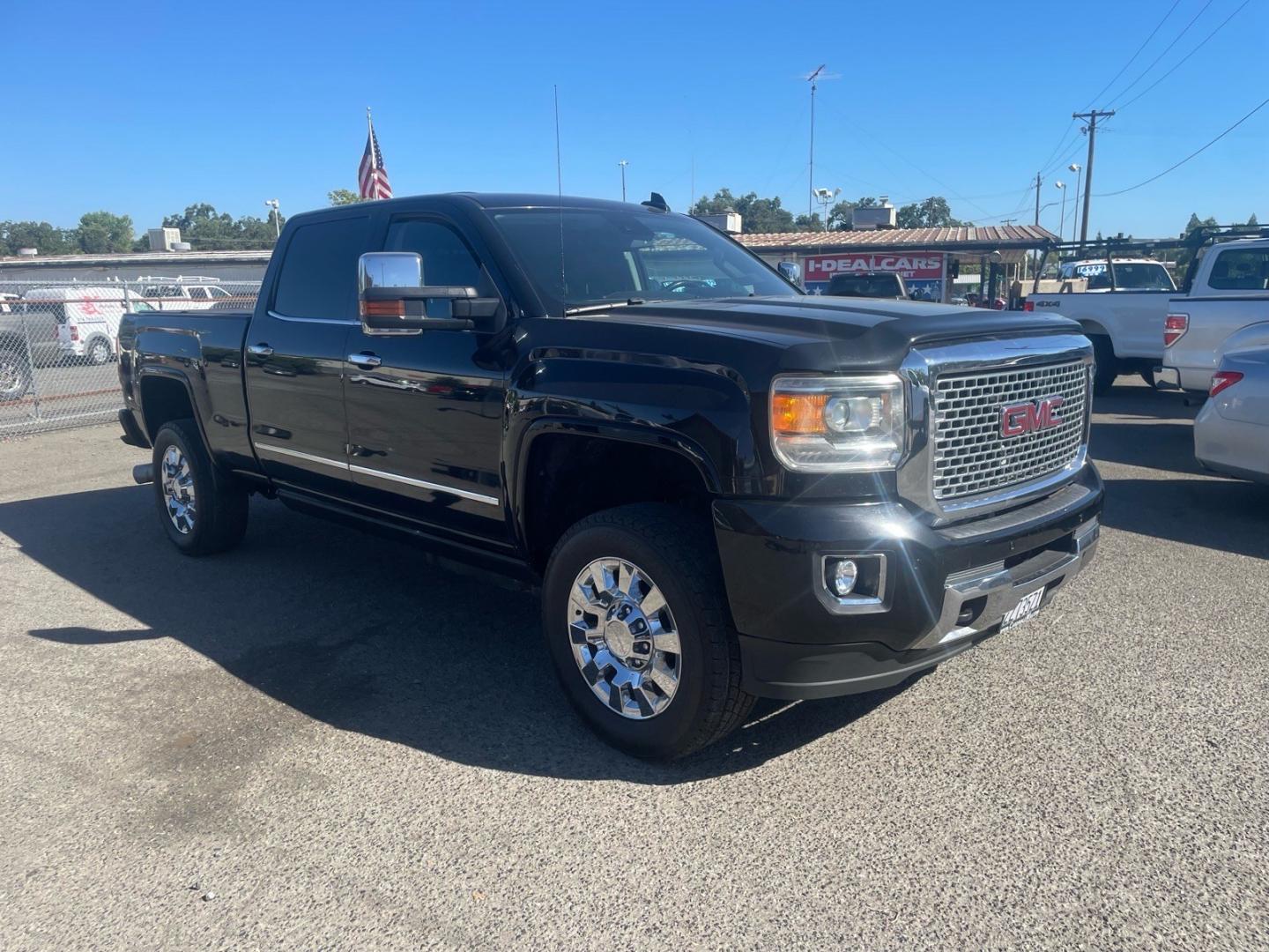 2016 Onyx Black GMC Sierra 2500HD Denali (1GT12UE83GF) with an 6.6L Duramax 6.6L Diesel Turbo V8 397hp 765ft. lbs. Common Rail Direct Injection engine, Allison 1000 6-Speed Shiftable Automatic transmission, located at 800 Riverside Ave, Roseville, CA, 95678, (916) 773-4549, 38.732265, -121.291039- Photo#1