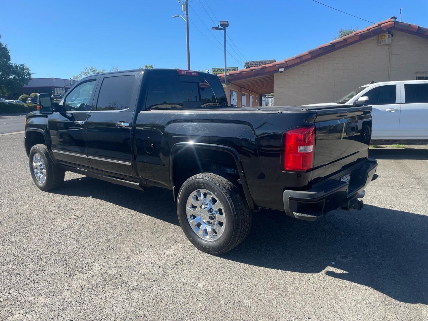 2016 Onyx Black GMC Sierra 2500HD Denali (1GT12UE83GF) with an 6.6L Duramax 6.6L Diesel Turbo V8 397hp 765ft. lbs. Common Rail Direct Injection engine, Allison 1000 6-Speed Shiftable Automatic transmission, located at 800 Riverside Ave, Roseville, CA, 95678, (916) 773-4549, 38.732265, -121.291039- Photo#2