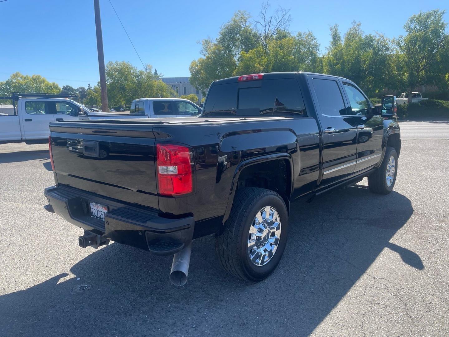 2016 Onyx Black GMC Sierra 2500HD Denali (1GT12UE83GF) with an 6.6L Duramax 6.6L Diesel Turbo V8 397hp 765ft. lbs. Common Rail Direct Injection engine, Allison 1000 6-Speed Shiftable Automatic transmission, located at 800 Riverside Ave, Roseville, CA, 95678, (916) 773-4549, 38.732265, -121.291039- Photo#3
