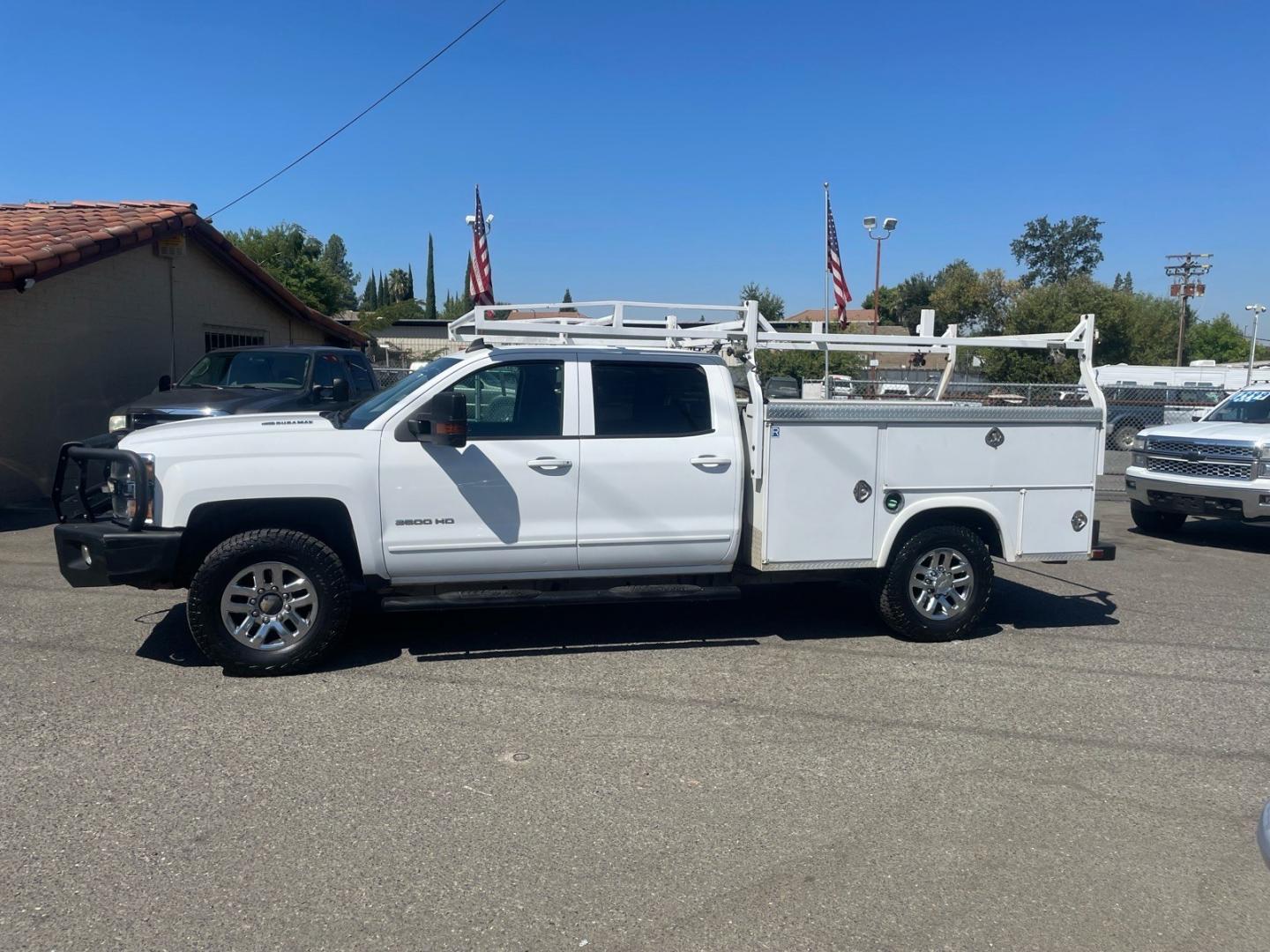 2015 Summit White Chevrolet Silverado 3500HD LT (1GB4KZE82FF) with an 6.6L Duramax 6.6L Diesel Turbo V8 397hp 765ft. lbs. Common Rail Direct Injection engine, Allison 1000 6-Speed Shiftable Automatic transmission, located at 800 Riverside Ave, Roseville, CA, 95678, (916) 773-4549, 38.732265, -121.291039 - DURAMAX DIESEL CREW CAB 4X4 LT UTILITY BED ALLISON TRANSMISSION ARB BUMPER WARN WINCH- Photo#5
