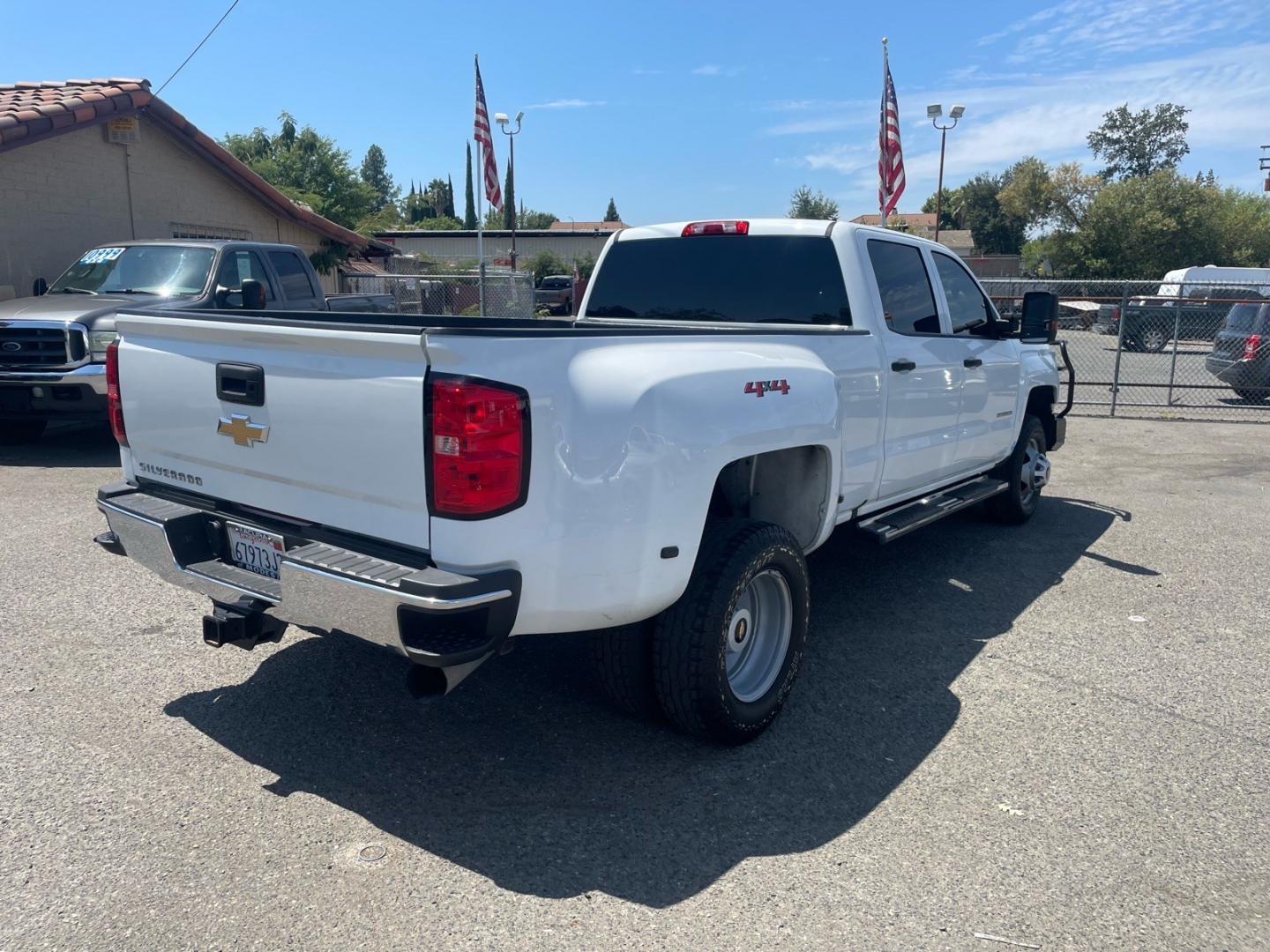 2019 Summit White Chevrolet Silverado 3500HD Work Truck (1GC4KVCY0KF) with an 6.6L Duramax 6.6L Biodiesel Turbo V8 445hp 910ft. lbs. Common Rail Direct Injection engine, Allison 1000 6-Speed Shiftable Automatic transmission, located at 800 Riverside Ave, Roseville, CA, 95678, (916) 773-4549, 38.732265, -121.291039 - DURAMAX DIESEL CREW CAB DUALLY 4X4 DIESEL ALLISON TRANSMISSION SERVICE RECORDS ON CLEAN CARFAX- Photo#4