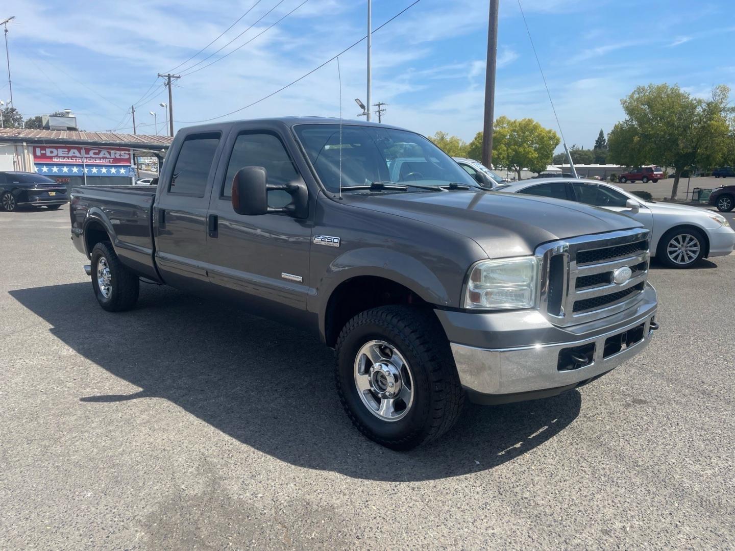 2005 Dark Shadow Grey Clearcoat Metallic Ford F-250 Super Duty Lariat (1FTSW21P45E) with an 6.0L Power Stroke 6.0L Diesel Turbo V8 325hp 560ft. lbs. Direct Injection engine, 5-Speed Automatic transmission, located at 800 Riverside Ave, Roseville, CA, 95678, (916) 773-4549, 38.732265, -121.291039 - DIESEL CREW CAB 4X4 FX4 LARIAT HEADSTUDS SERVICE RECORDS- Photo#1