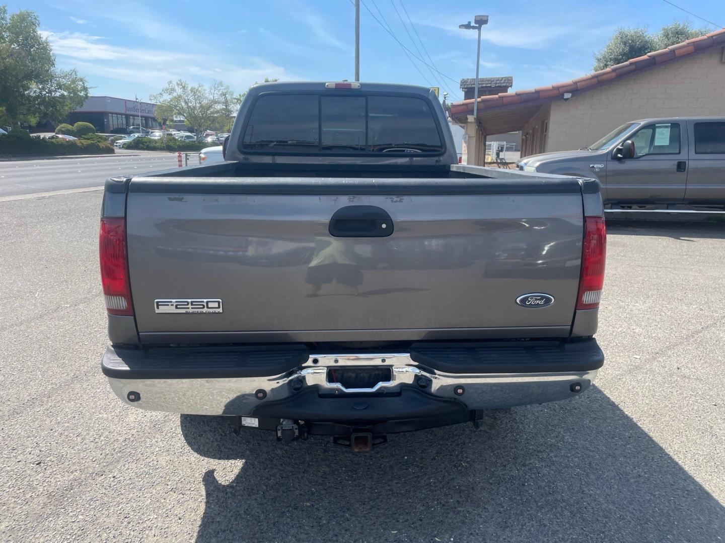 2005 Dark Shadow Grey Clearcoat Metallic Ford F-250 Super Duty Lariat (1FTSW21P45E) with an 6.0L Power Stroke 6.0L Diesel Turbo V8 325hp 560ft. lbs. Direct Injection engine, 5-Speed Automatic transmission, located at 800 Riverside Ave, Roseville, CA, 95678, (916) 773-4549, 38.732265, -121.291039 - DIESEL CREW CAB 4X4 FX4 LARIAT HEADSTUDS SERVICE RECORDS- Photo#7